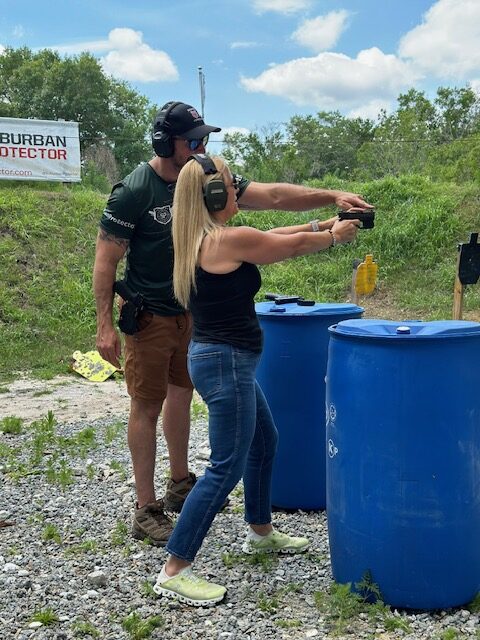 Mike teaching a firearm training student for their concealed weapons license