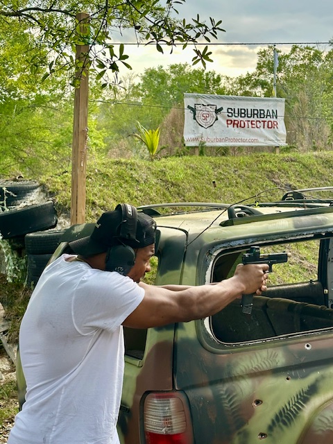 Client during a live fire vehicle defense drill
